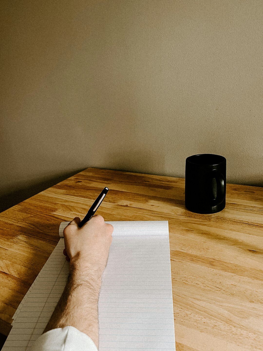 mystery author writing at desk